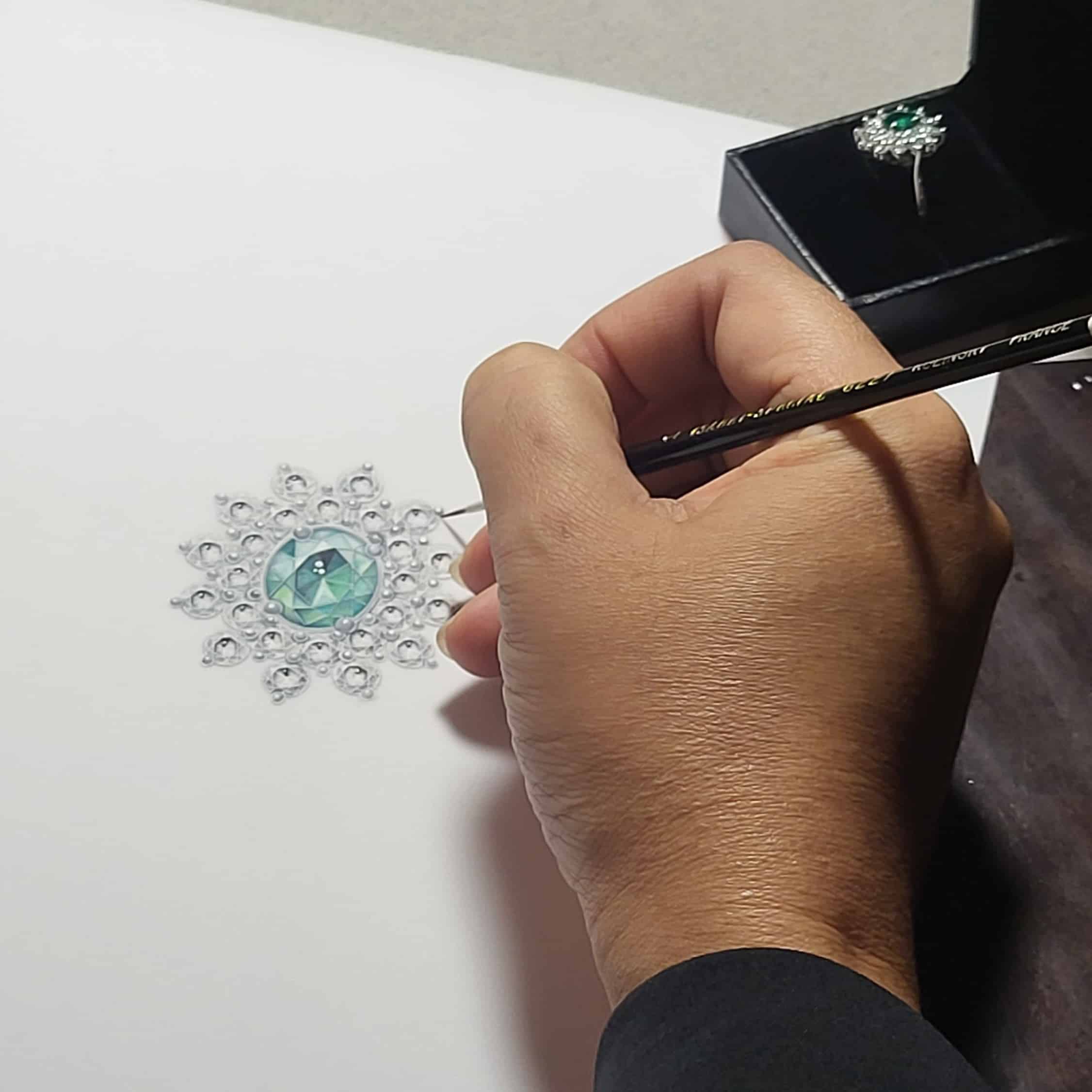 Un designer qui dessine un motifs bijoux
